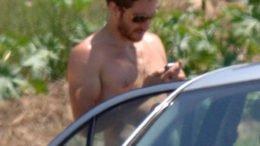 jake-shirtless-phone.jpg