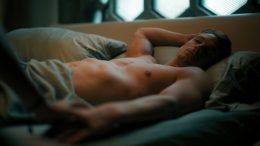 Joel Kinnaman in bed