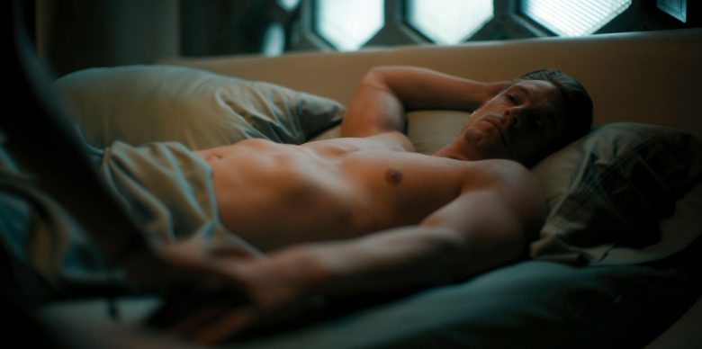 Joel Kinnaman in bed